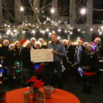 Ems-Highlander übergeben Scheck an Wünschewagen